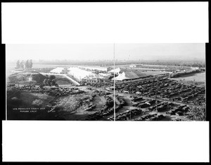 Panoramic view of the Los Angeles County Fair in Pomona, showing parked automobiles, 1928