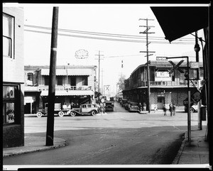 Looking east along Marchesseault Street at the intersection of Alameda Streetin the Old Chinatown with signs for Chop Suey, ca. 1935