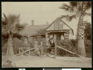 Portrait of John A Baxter's grandmother on the porch of the family home, Monrovia, 1905