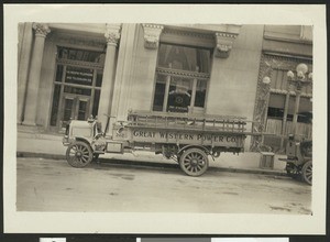 Great Western Power Company truck loaded with ladders, parked in front of The Pacific Telephone and Telegraph Company, ca.1910