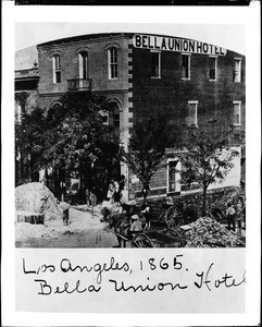 View of the Bella Union Hotel in Los Angeles, showing workers around mounded dirt and rubble, ca.1865