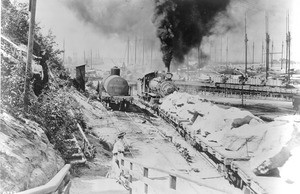 A steam engine hauling rock for the construction of the San Pedro breakwater, ca.1899