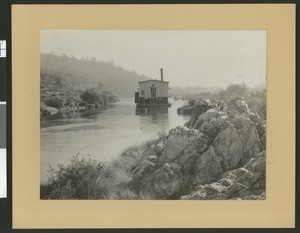 Gold dredge at work in Middle Creek, Redding