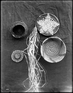 Four unidentified Indian baskets on display, ca.1900