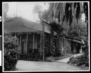 Exterior view of the corridor and south end of the Palomares adobe after its restoration, ca.1940