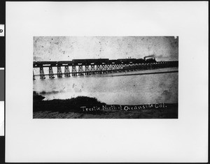 Atchison, Topeka and Santa Fe Railroad engines #11 and #144 on a trestle north of Oceanside December 18, 1886