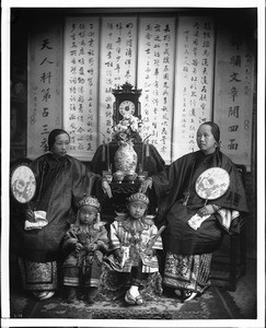 Chinese mother, daughter and children in fine costume