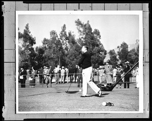 Portrait of golfer Walter Haagen hitting a tee shot at the Los Angeles Open at the Los Angeles Country Club, 1932