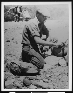 Man mining in the desert, ca.1907