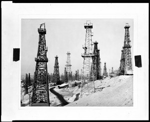 Unidentified oil derricks on the side of a hill, ca.1930