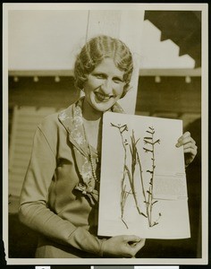 California Botanic Gardens, showing woman displaying pressed flowers