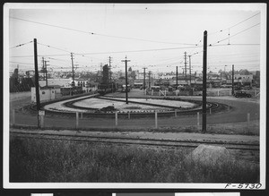 Pico Boulevard bus terminal, showing a loop of railroad tracks at center, April 12, 1937