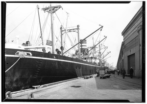 Large boat docked at a wharf