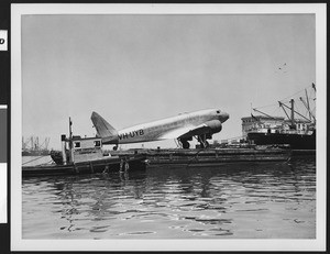 Douglas DC-2 plane at Los Angeles Harbor ready for shipment to Australia, 1937