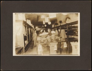 Six men inside an unidentified tailor's shop, ca.1880-1889