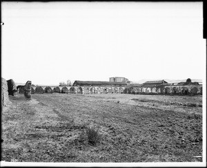 View of the large courtyard at Mission San Juan Capistrano, Orange County, ca.1900