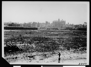 View of commercial buildings from across a cleared lot in Los Angeles