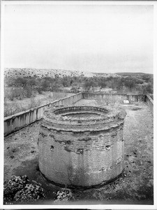 Ruin of the mortuary chapel at Mission Tumacacori, from the roof of the church, Arizona, ca.1908