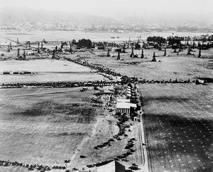 Aerial view of the intersection of Wilshire Boulevard and Fairfax Avenue looking north during and aviation fair, Los Angeles, 1920