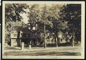 Two houses on an unpaved residential street in Eugene, Oregon