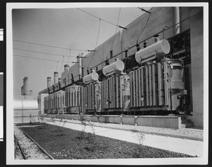 Exterior view of the Long Beach Steam Plant transformers, ca.1930