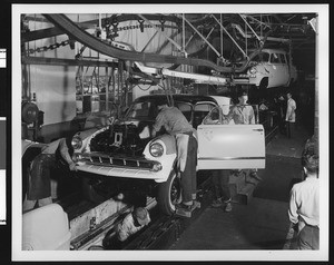 Interior view of assembly line at the Chrysler factory in Commerce, CA, 1952-1953