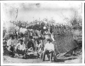 A group of Yaqui Indians at their thatched dwelling, Mexico, ca.1910