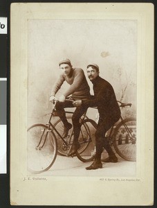 Portrait of two male cyclists, ca.1890