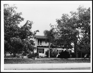 Exterior view of a two-story Spanish-style house in Los Angeles