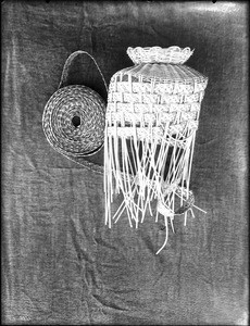 Unidentified Indian basket under construction on display, ca.1900