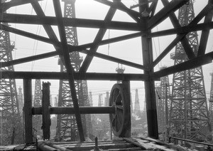 A view looking south through an oil derrick, Signal Hill, December 28, 1932