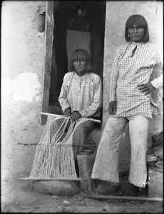 Hopi men preparing warp for weaving a dress, Arizona, ca.1898