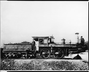 Steam engine trailing its coal car on the Los Angeles and San Gabriel Valley Rail Road, 1890