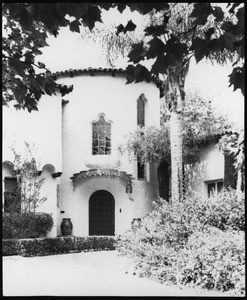 Exterior view of the entrance to a Spanish Revival house in Hancock Park, Los Angeles