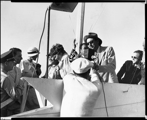 Amelia Earhart posing with Vance Graham of KMPC before making a flight, July 4, 1933