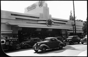 Exterior view of the A & P Market and Thrifty Drug Store at Sunset and Fairfax from across the street, ca.1940