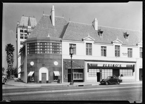 View of Perino's Restaurant and the surrounding shops on Wilshire Boulevard in Los Angeles, 1940