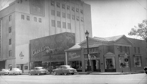 View of the 9600 block of Wilshire Boulevard in Beverly Hills, showing Saks Fifth Avenue and other shops