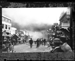 People working to extinguish the fire on the Ocean Park pier in Santa Monica, 1912