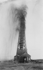 Standard Oil siphon gushing oil at the Midway-Sunset Oil Field of Kern County, ca.1920