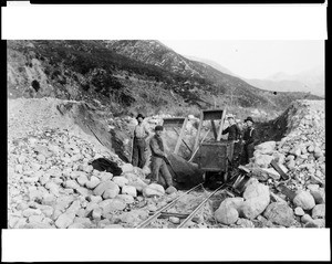 View of four miners working in an unidentified location in California, ca.1900