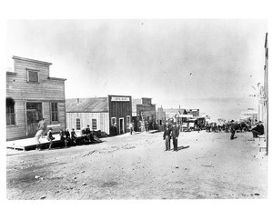 Pedestrians congregated on an unidentified street in Randsberg, California, 1898