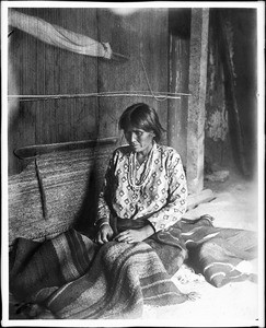 Navajo Indian woman blanket maker with blankets and loom, ca.1901-1903