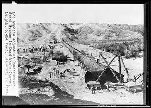 Workers constructing a steel syphon during aqueduct construction in Dead Man's Canyon