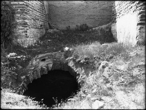 Hole broken into the vault or wine cellar of Mission San Antonio de Padua, California, ca.1906