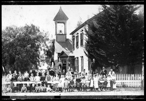 Group portrait of the students and teachers of the Dow School in front of the school, September 1886