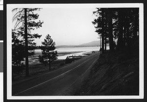 Big Bear Lake from Big Bear Boulevard, south shore, including the trees and hills on north shore, ca.1950