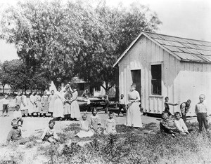Students and teachers outside of a Lankershim Ranch School in bunkhouse, San Fernando Valley, ca.1889