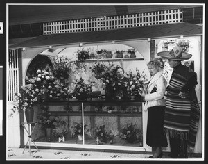 Flower booth at a Chamber of Commerce exhibit, ca.1930