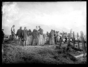 Paiute indian funeral, showing two horses in the background, ca.1900